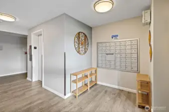 Main entrance with elevator and secured mailboxes.