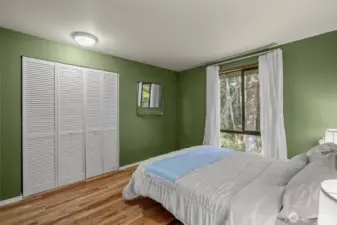 Bedroom 2 with hardwood floors.