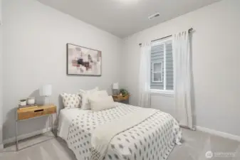 Cozy main level bedroom, perfect for guests.