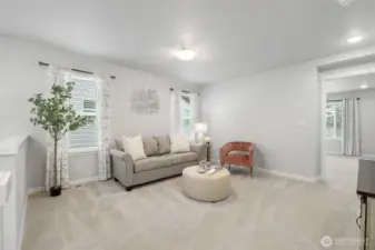 Bright and cozy loft connecting the upper-level bedrooms.