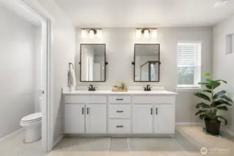 Large primary bathroom featuring an upgraded shower and separate water closet.
