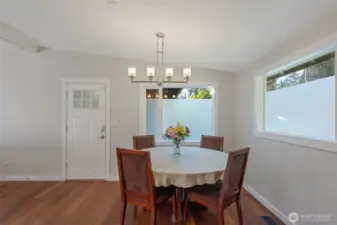 Dinning area with beautiful light fixtures