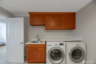Laundry with sink, counter and cabinets