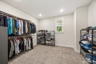 Spacious primary closet. Plenty of room for a custom design here!