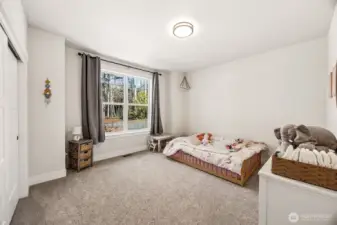 Bedroom #3 faces the front yard, carpeted flooring, dual ensuite bathroom that adjoins bedroom #4.