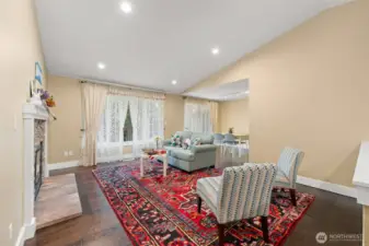 Vaulted ceilings, walls of windows, gleaming hardwood floors, abundance of spaces.