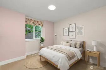 One of 2 main floor bedroom is virtually staged