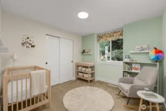 Another main floor bedroom is virtually staged