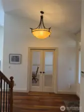 Entrance has a study with French doors to right as you enter. Coat closet is to the left side,