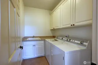Conveniently located, the laundry room is just of the Primary Suite.