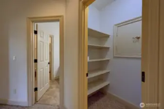 In the upstairs hallway is a large walk-in linen closet.