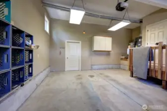 Large garage with a workshop behind the door.