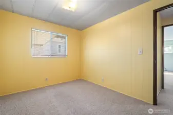 The secondary bedroom can support a queen-sized bed.