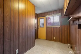 This door leads to the back side of the house, to the shed.