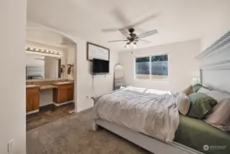 Primary Bedroom with ceiling fan and lots of room.