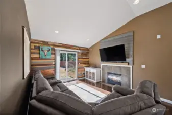 Living room with custom woodwork and vaulted ceilings.