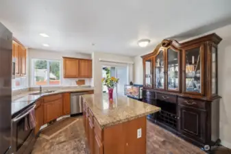 Functional kitchen w/island. Slider to front of house makes it easy to transport items from the driveway.