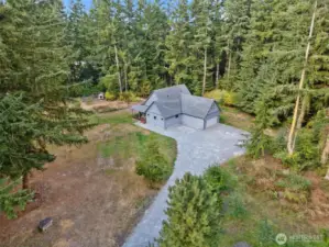 Superbly constructed eco-friendly custom home nestled in nature on 4.35 serene level acres!