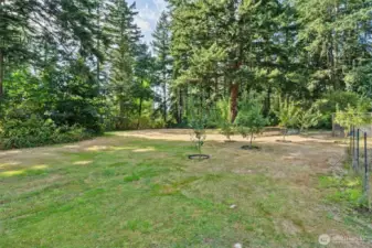 The peaceful and private property boasts a park-like setting with perennial crops, an edible garden, a mini-orchard w/20 +/- fruit trees, woodshed, chicken coop and firepit.