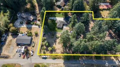 Almost 2-1/2 acres! Includes sunny spaces and tree-drenched areas too.