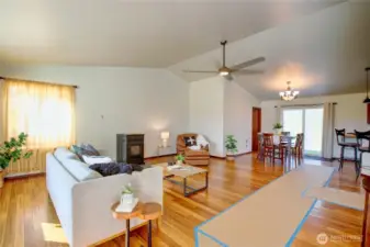 Lovely open concept, cozy pellet stove, formal dining room, vaulted ceilings and kitchen adjoining.