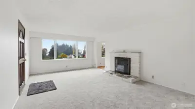 A bright, neutral living room providing a perfect canvas for any style or setup.