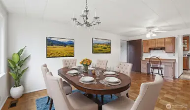 Virtually staged to inspire, this dining space features a bright setting ideal for everyday dining or special occasions