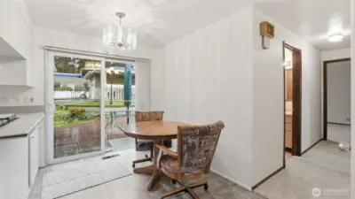 This cozy dining space overlooking the backyard—perfect for morning coffee or casual meals
