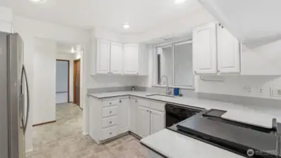 Open kitchen with spacious counters and a bright, easy-to-navigate layout.