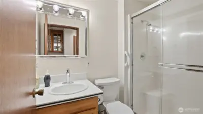 A well-placed 3/4 bathroom offering a clean design and easy access from nearby rooms.