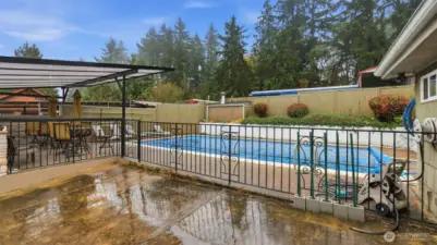 Enjoy a refreshing dip in your own backyard pool, complete with fenced surround and ample lounging space.