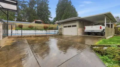 Garage with 1/2 bath, offering extra convenience for yard work, pool use, or workshop needs.