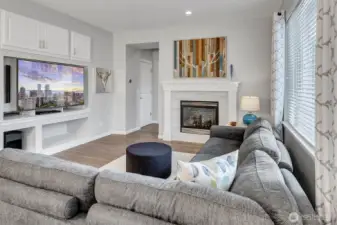 Great room adjacent from the kitchen w/cozy gas fireplace + custom mantle w/beautiful built ins make this the happiest room in the home! West facing windows fill the home with sun all year round.  Backing to a nature reserve simply adds to the magic of this truly special home.