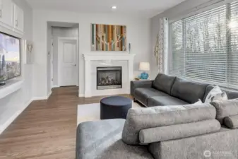 Great room w/garage entry/mudroom/laundry and powder bath. West facing windows fill the room with sunshine and spectacular sunsets.