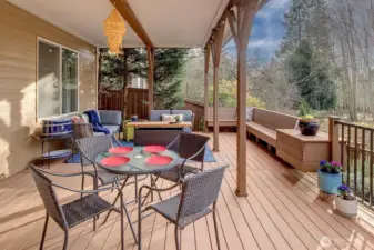 The lower level deck is covered for those rainy days....ideal for firepit fun and again, simply surrounded by a nature...not, neighbors! Low maint terra tech decking w/custom seating and storage, heat lamps too! This is one fun place + space!
