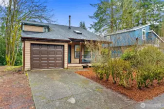 Clean exterior with a newer roof and garage door.