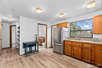 Convienient half bath off the kitchen, and downstairs office or bedroom on the left.