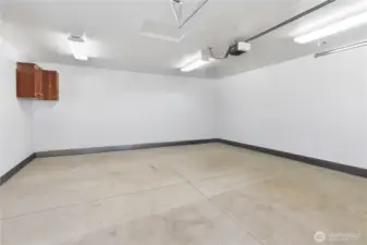 Garage with workbench and mounted cabinets