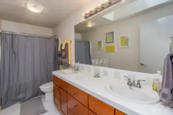 Full guest bath with double sinks.