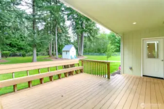 Back partially covered trex deck with access to kitchen
