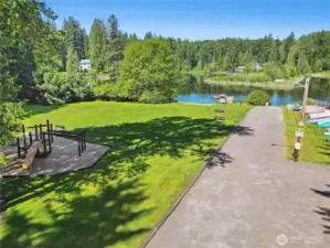 Community Beach with Playground, dock, and watercraft storage.