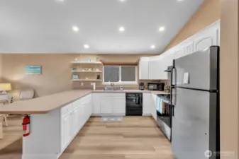 Super big kitchen open to large spacious area for eating or lounging