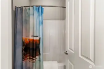 Private shower and toilet in second bathroom