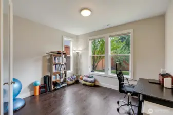 Home office with flex space located conveniently off the main entry.
