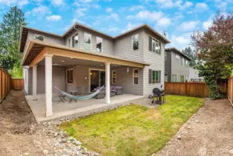 Covered wraparound patio to relax and enjoy life.