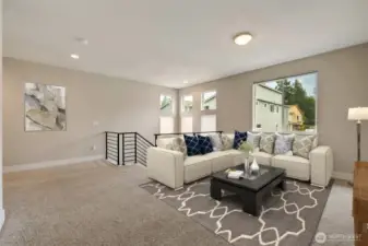 Upper level loft/ family room. Virtually staged.