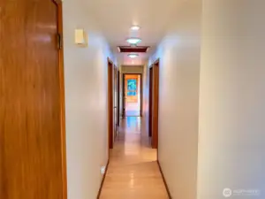 Hallway to the Bedrooms and the Sunroom at the end.