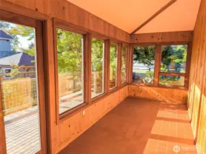 Sunroom in all its glory!  Deck runs the length of the room leading to the back yard.  A real indoor/outdoor experience!