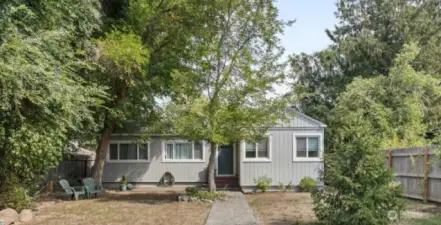 Cozy 1940s Charm in the Heart of Downtown  This well-loved home blends timeless character with thoughtful updates. Fresh paint throughout, new carpet, updated doors, and charming built-ins make it move-in ready. Bright, sun-filled rooms create a warm and welcoming feel the moment you step inside. Close to shops, restaurants and schools. Welcome Home!
