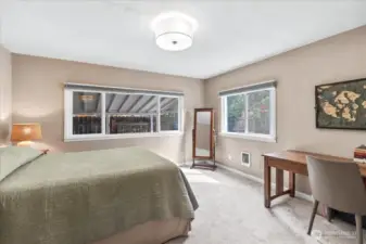 Primary Suite includes a half bath with new sliding door and storage shelf